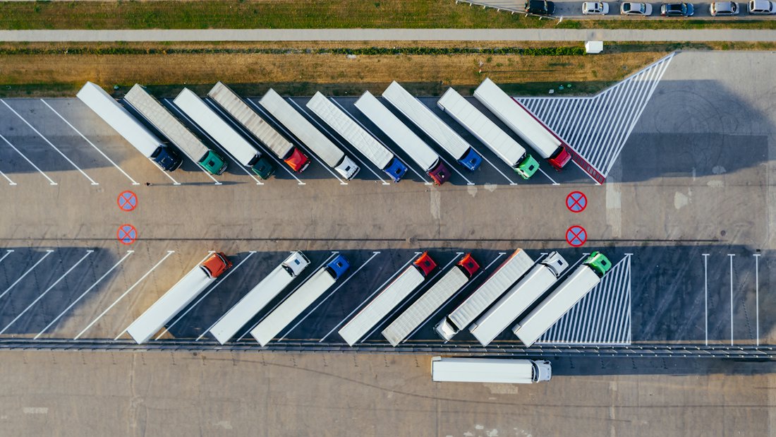 Trucks parked at the loading docks of a distribution centre, seen from above